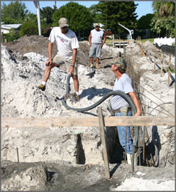 D&D crew pouring concrete.